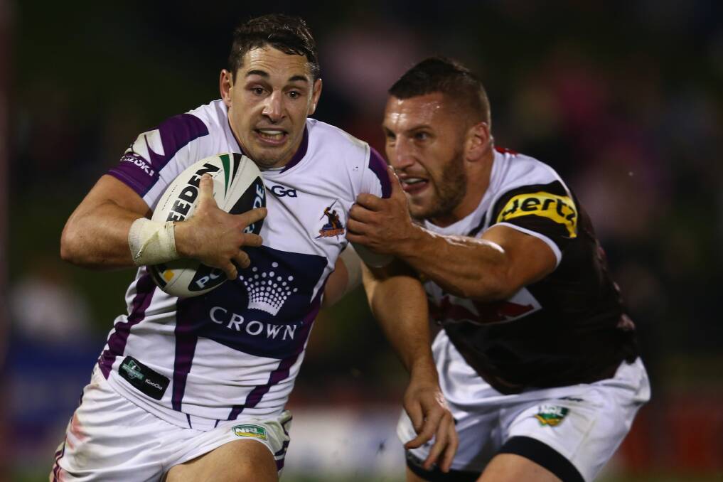 GO WEST: Melbourne Storm's Billy Slater runs past Penrith Panthers' Lewis Brown in last season's NRL fixture. The two sides will clash at Bathurst's Carrington Park in the 2014 season. Photo: GETTY IMAGES