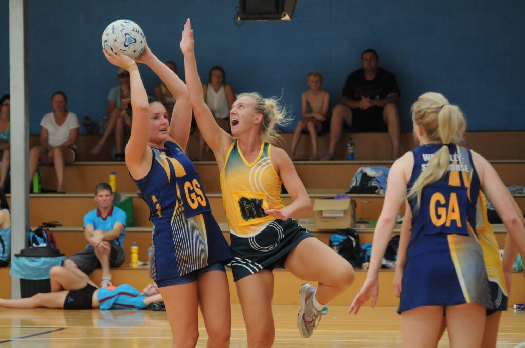 Mardi Aplin (yellow) filled in admirably for Baulkham Hills A in SUnday's final against ACT under 21s. Photo: STEVE GOSCH