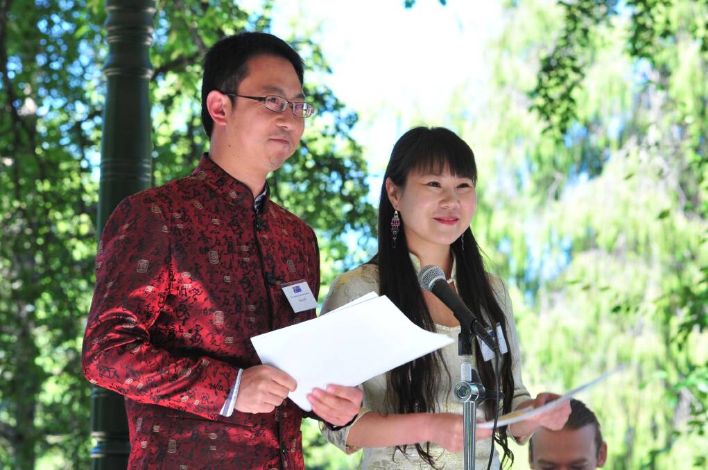 New Australian citizens Dong Liu Zhang and Lujia Liu Zhang taking the oath. Photo: JUDE KEOGH