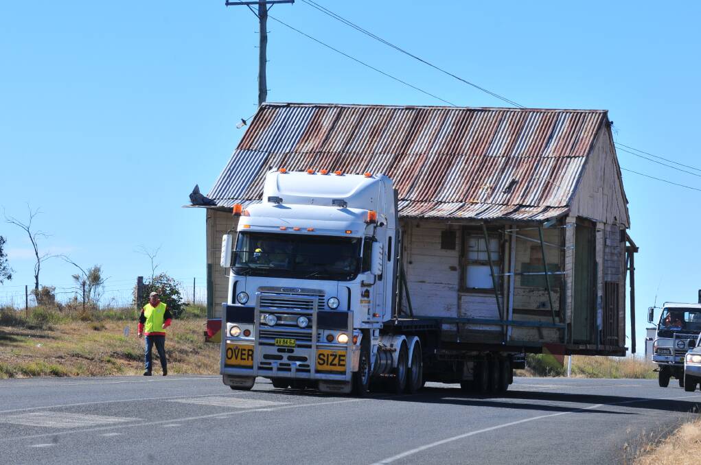 ON THE MOVE: Emmaville cottage on the move from Waratahs to the Botanical Gardens. Photo: JUDE KEOGH