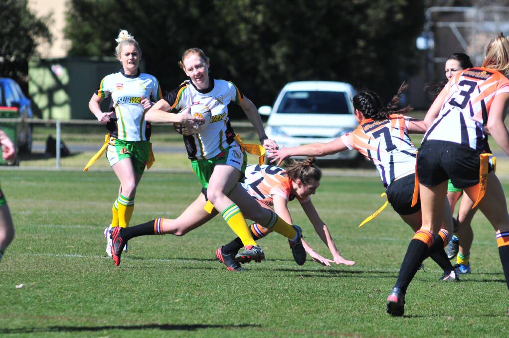 SHE'S AWAY: CYMS Nicole Williamson avoids the Lithgow defence in women's league tag.