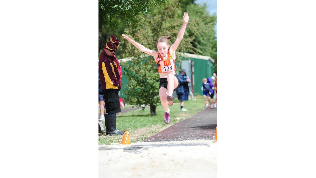 LONG SHOT: Orange's Emily Pell tackles the long jump at the state multi championship.