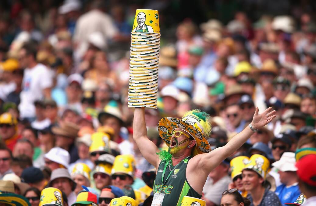 LEADER OF THE PACK: An Aussie fan attempts to ignite the home crowd's fury at the MCG on day three of the Boxing Day Test. Photo: GETTY IMAGES