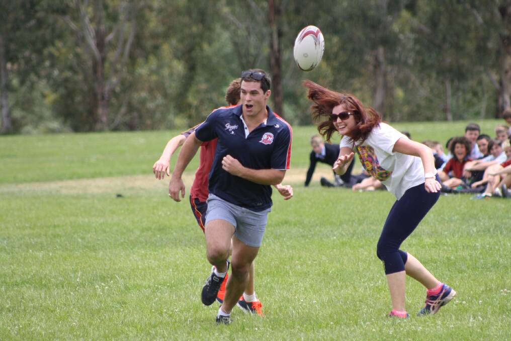 November 8 - Sydney Roosters NRL grand final-winner Dan Mortimer visited James Sheahan Catholic High School to play social touch footy game and then talk to year 11 students about their physical education studies. Photo: MICHELLE COOK 1108mcmort