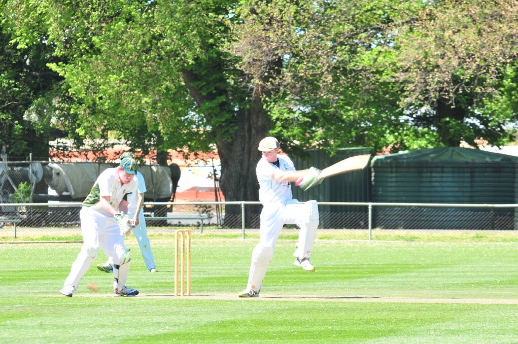 SHOT: Orange City's Shaun Grenfell nails a cut shot as CYMS wicketkeeper Dave Neil laments another possible dropped catch.