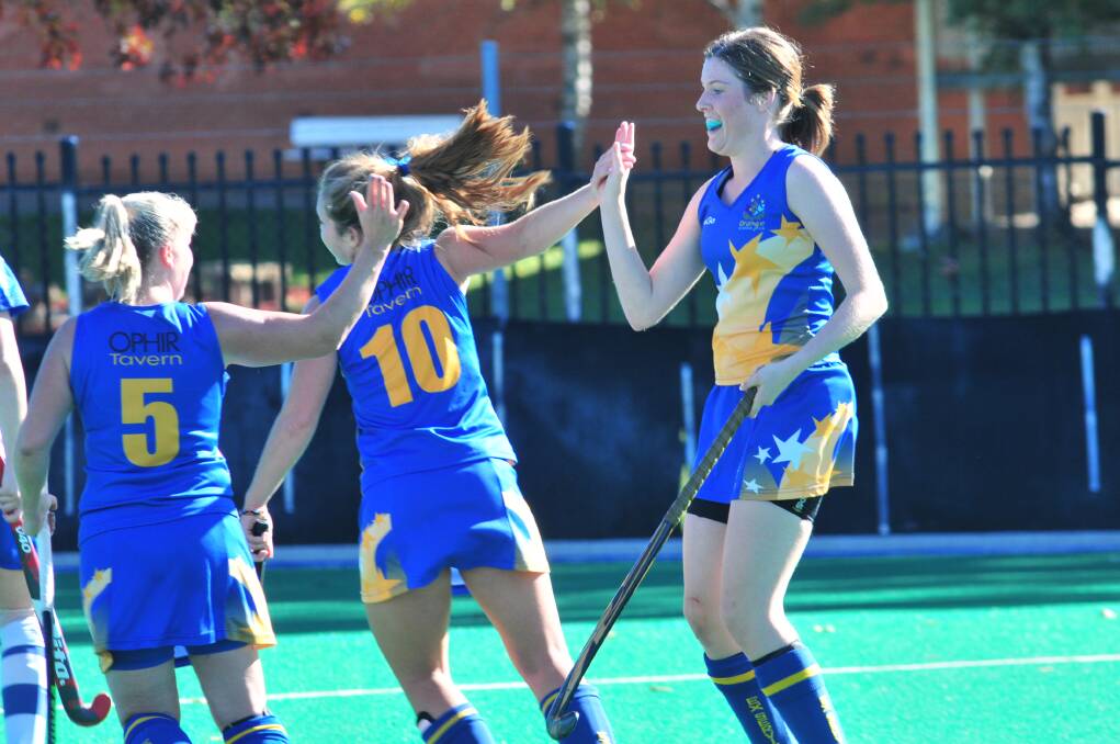 YAY: Orange Ex-Services celebrate a goal in the women's PLH.