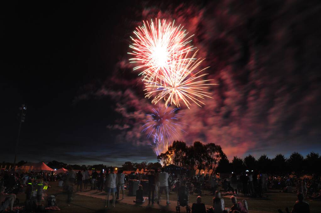 NEW YEAR'S EVE 2013: The fireworks light up the Orange skyline. Photo: STEVE GOSCH