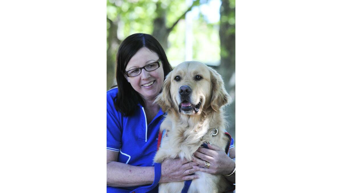 POOCH: Assistance Dogs satellite trainer Pam Davis with Bono. Photo: JUDE KEOGH
