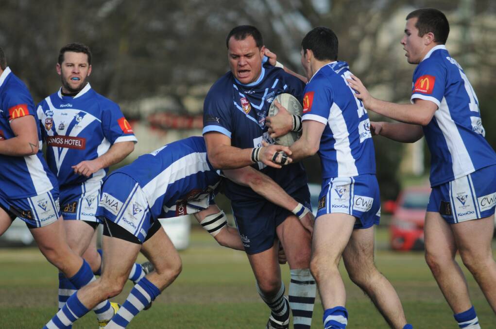 RAMPAGING: Hawks prop Arty Shead hits one up against Bathurst St Pat's.