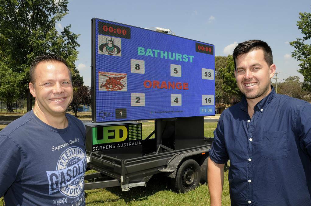 BATHURST: Myles Duggan and Daniel Dibley with their revolutionary mobile LED screen. Photo: CHRIS SEABROOK 010714cscreen