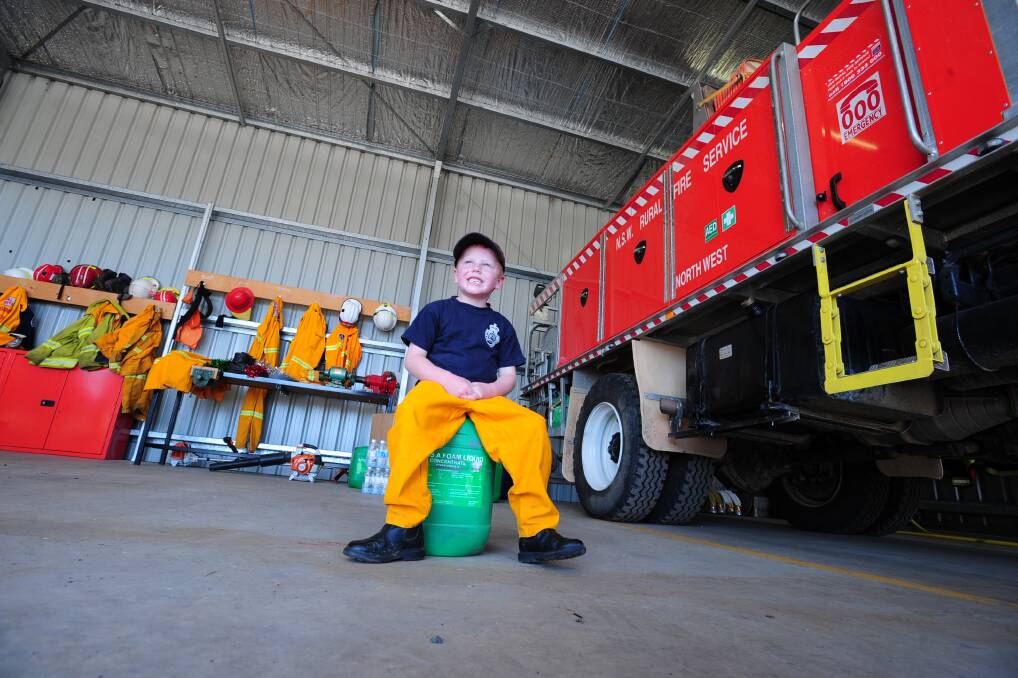 BIG BOOTS TO FILL: Oliver Jarick is going to be a fireman. Photo: STEVE GOSCH