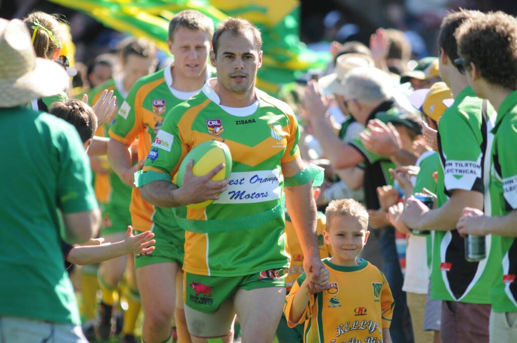 EXPERIENCED: CYMS skipper Mick Sullivan leads his team out for the Group 10 grand final.