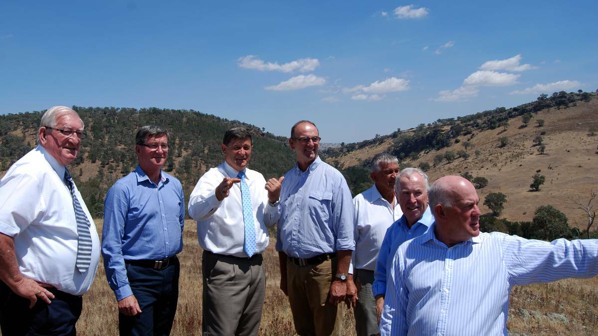 WHO'S MISSING?: John Cobb and several of the central west's mayors survey the Needles Gap site of the future dam.