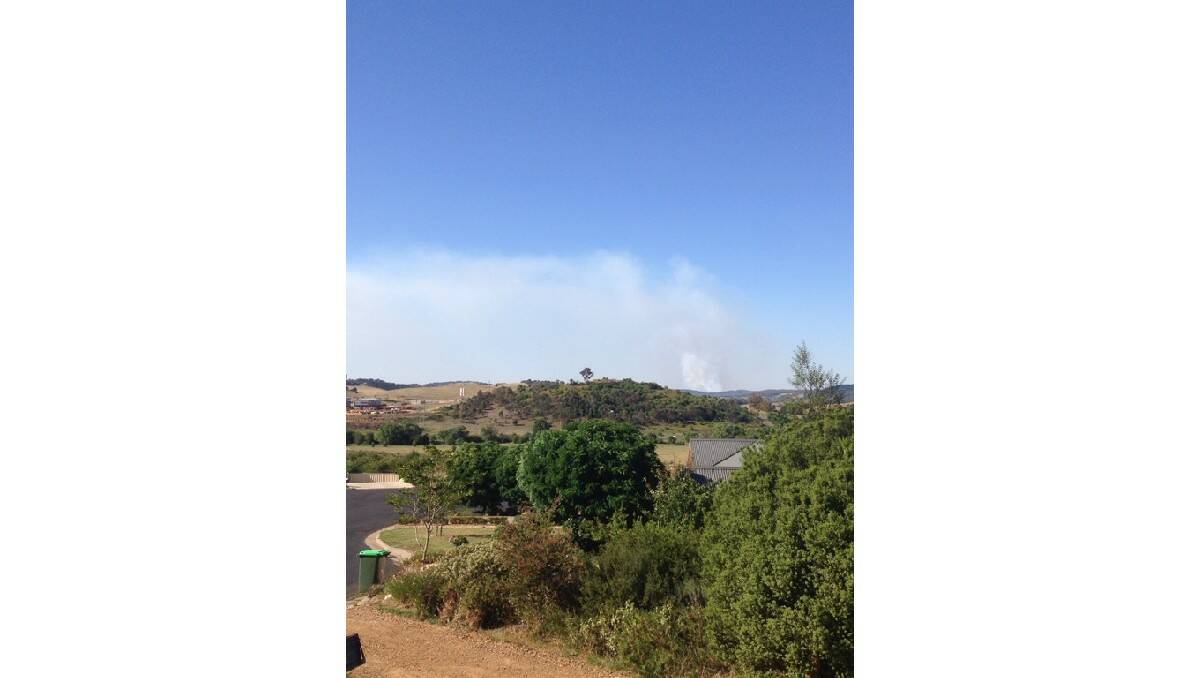 FIGHTING THE FIRE: Images of the blaze that has burnt out over 150 hectares at Mullion Creek, north of Orange. Photo: SASHA MCKENZIE