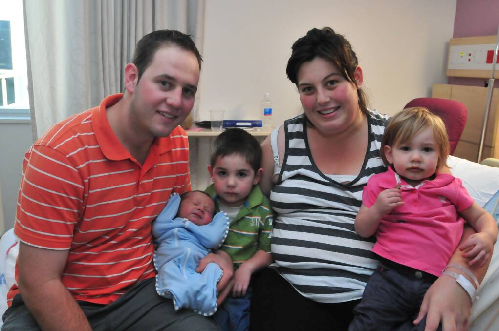 Baby Isaac, pictured with siblings Cooper and Tayla and parents Matthew Smith and Zanette Wood, was born on February 2.