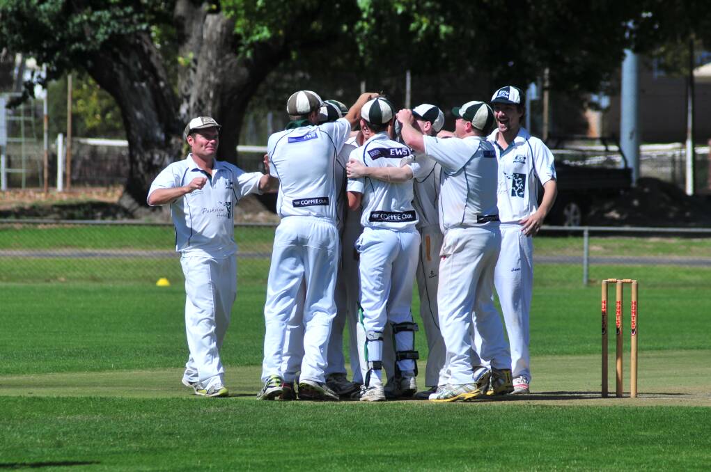 OH WHAT A FEELING: Orange City come to terms with winning this year's ODCA first grade premiership, and what better way to do so than by engaging in a group hug.