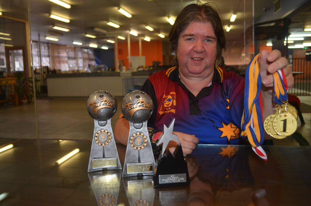 BOWLING THEM OVER: Donna Holland cleaned up at the Australian Blind and Vision Impared Tenpin Championships.
