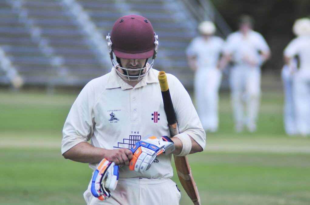 CRICKET: Cavaliers' Richie Venner walks off after being dismissed in Saturday's ODCA first grade one day final against CYMS. Photo: JUDE KEOGH