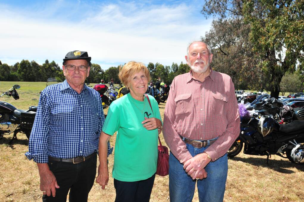 TOY RUN: John and Loraine Weekes and Charlie Stammers. Photo: JUDE KEOGH
