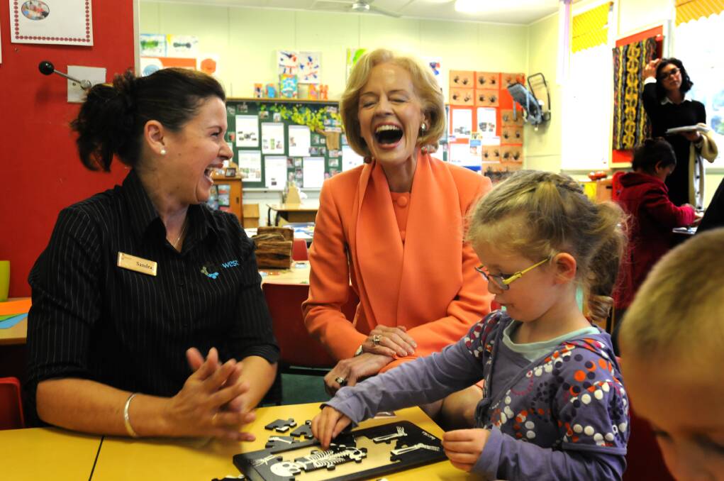 SMILE A WHILE: Carewest childcare assistant teacher Sandra Hazzard, GG Quentin Bryce and Jessica Thorley. Photo: STEVE GOSCH