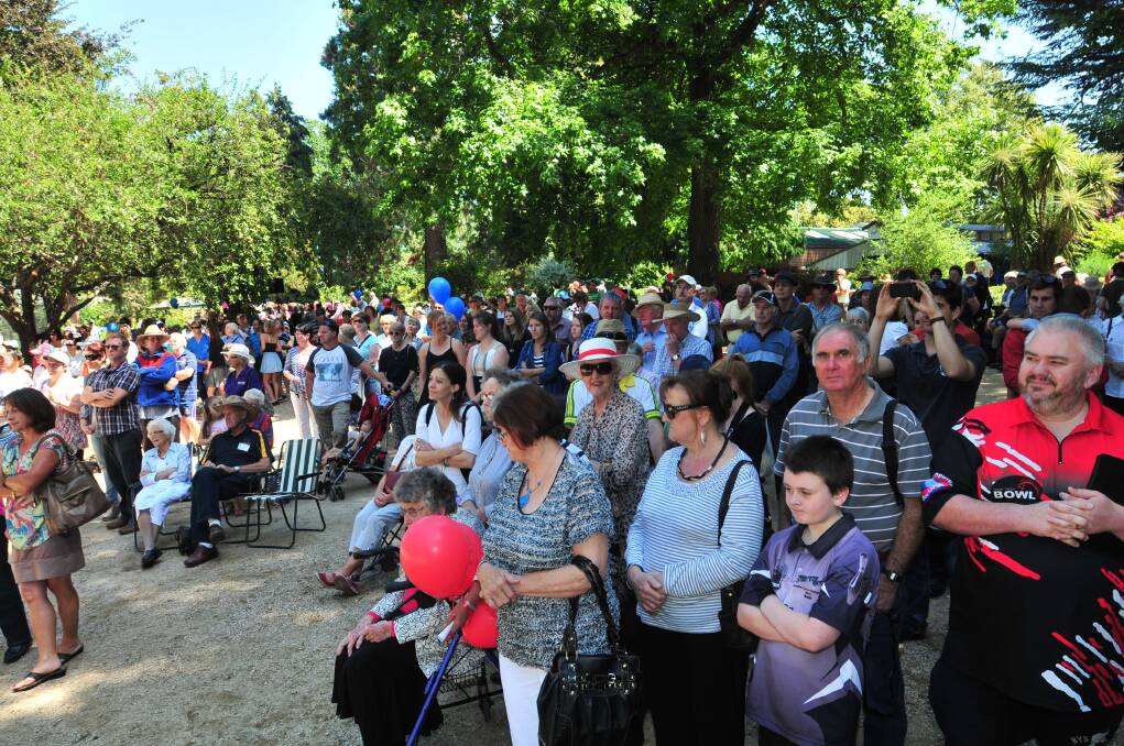 The crowd watches the Australia Day presentations at Cook Park on Sunday. Photo: JUDE KEOGH