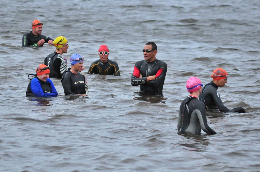 ICE TO SEE YOU: Triathletes get wet before the start of the Central West Inter-club triathlon.