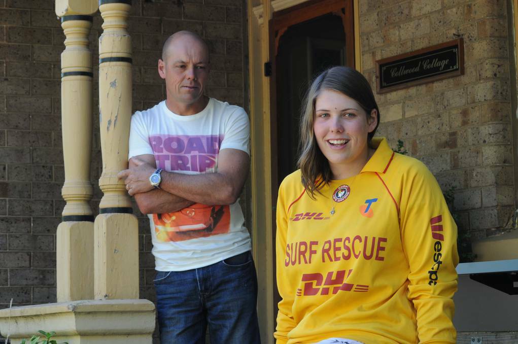 ORANGE: Amber Collins, pictured with her father John, is back in class at Orange High School with her friends and teachers probably unaware the humble teenager saved the life of a seven-year-old boy in treacherous surf at Dee Why Beach on Australia Day.