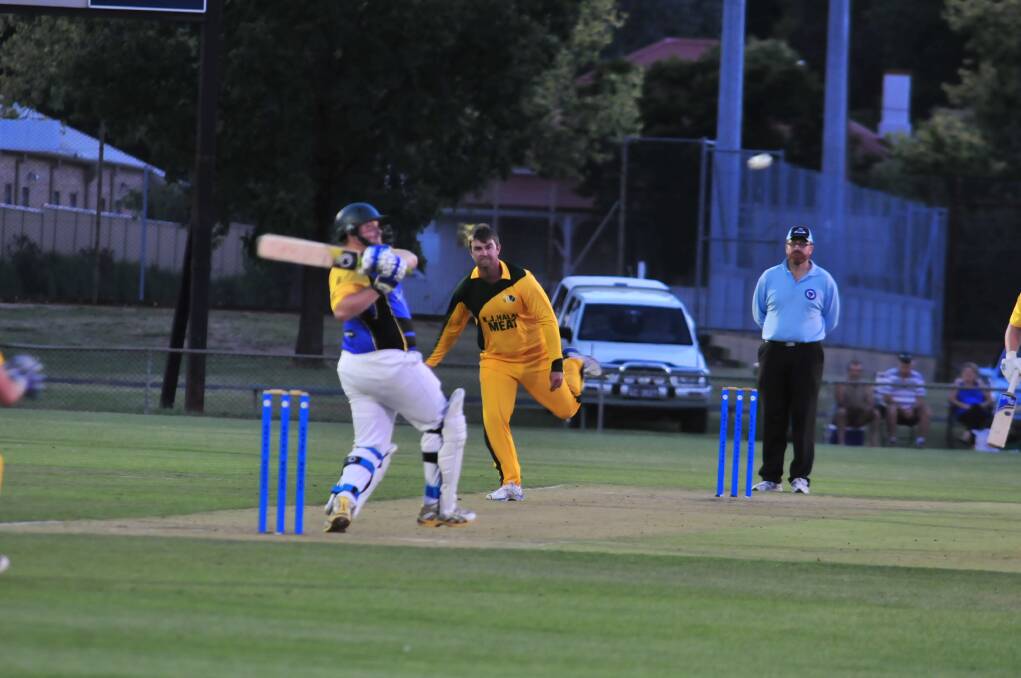 CRICKET: Blayney's Jason Stanbridge bowls to Orange City's Dave Boundy in a Royal Hotel Cup game at Wade Park on Friday night. Photo: JUDE KEOGH