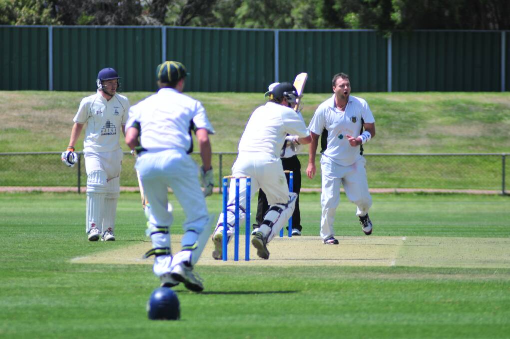 CRICKET: CYMS' Chris Novak bowls to Cavaliers' James Ryan in Saturday's ODCA first grade one day final at Wade Park. Photo: JUDE KEOGH