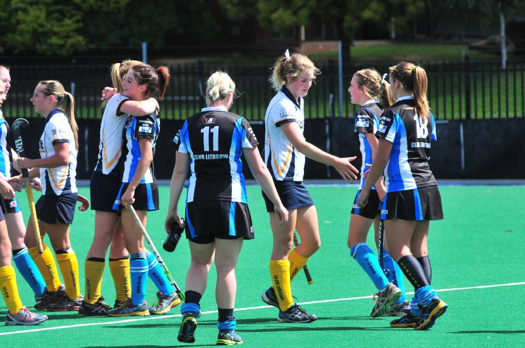 COME HERE: Kinross-CYMS and Lithgow Zig Zag players embrace following the end of a gruelling women's PLH match.