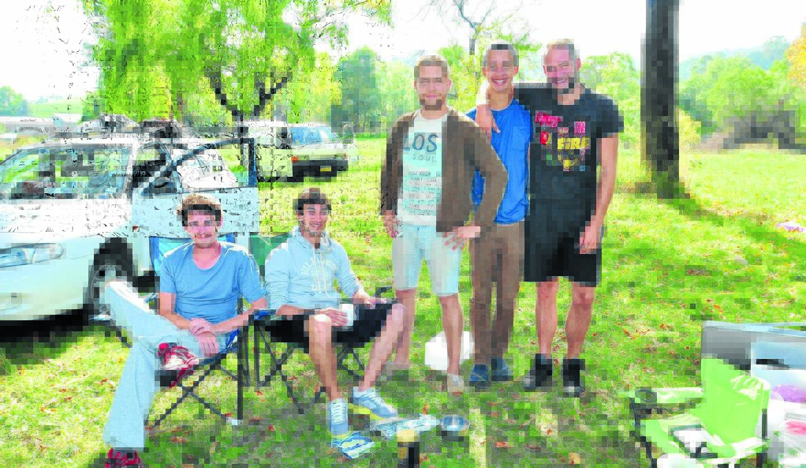 TEMPORARY HOME: French backpackers Masrc Charrier, Samuel Jacq, Dennis Akassar, Romec Lusne and Jeremy Ponseel camp out at the base of Mount Canobolas because they say there are no other free camping sites in the area. Photo: JUDE KEOGH                                                                                                                      0315campers1