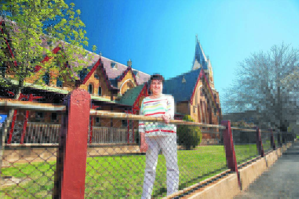 HONOUR: Prue McCarthy, outside Orange Public School, will feature on the front page of this year’s White Pages and Yellow Pages. Photo: Supplied.
