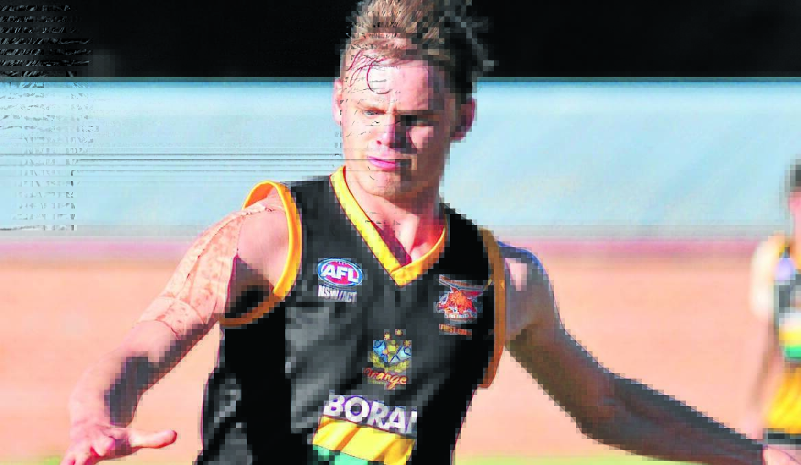 HUGE LOSS: Orange Tiger are aiming for back-to-back premierships in 2014, but will have to do it without ruckman Jack Rogers. Photo: JUDE KEOGH 0427afl13