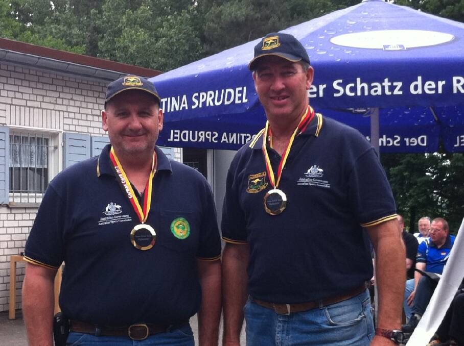 TWO OF A KIND: Orange Pistol Club shooters Dave Oates (left) and Dean Brus after winning the German International Open Two Man Club Team event last year in Germany. Both will represent Australia at the upcoming WA1500 World Championships.