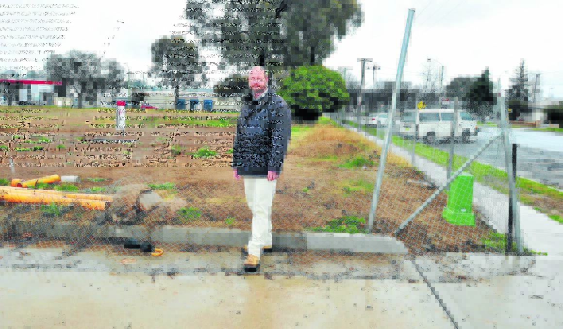 CHILD’S PLAY: Designer Ben O’Halloran at the site of the new childcare centre earmarked for the corner of McLachlan and Dalton streets. Photo: JUDE KEOGH                                                                                                                                                                 0715childcare1