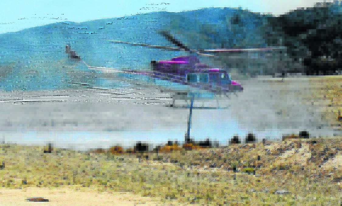 Eight aircraft worked throughout Friday afternoon to contain the Wattle Flat blaze.