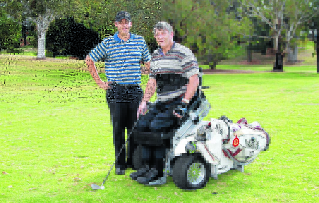 DETERMINED: Tony Gosper (right), pictured with Wentworth Golf Club pro Todd Iffland, wants to let people know that having disability is not an excuse for letting your dreams disappear. Photo: JEFF DEATH                                                                                                                                                                                                                                                                                                                                                                                                                                                                                                                                  0430jdgosper03