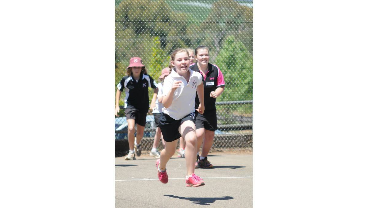 FUN TIMES: Canobolas Public School's Emily Gould runs for her life. Photo: STEVE GOSCH