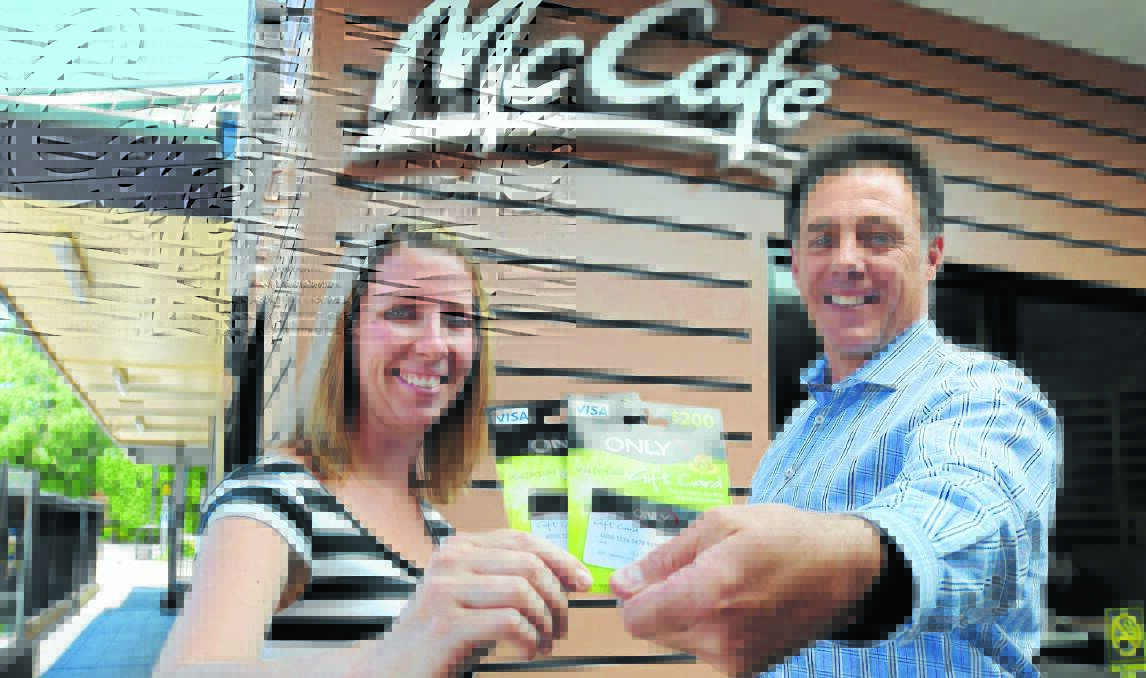 ON TOP OF THE WORLD: Orange’s top fashionista Rebecca Wignall tells McDonald’s franchisee Todd Bryant she is still over the moon with her win in the 2014 Orange Picnic Races McDonald’s Hot 100. Photos: STEVE GOSCH                      0128sgwinner