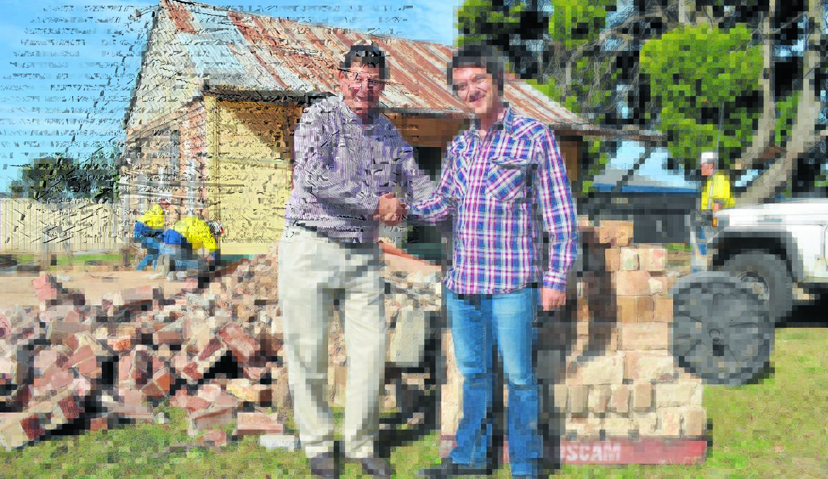 NO LAUGHING MATTER: Cr Reg Kidd and ABC TV producer Max Mackinnon at the former site of Emmaville cottage. Photo: CLARE COLLEY 0429ccbanjoabc