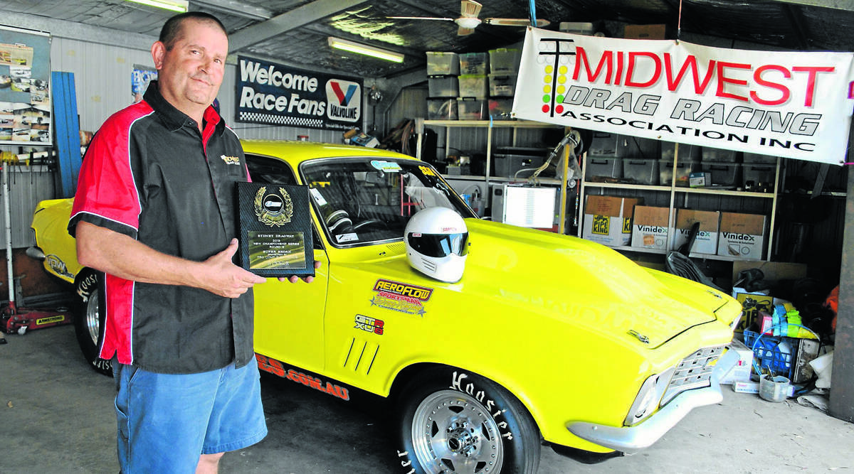 FORBES: Michael Little with his award for placing third in the 2013 NSW Drag Racing Championships. 0114michaellittle