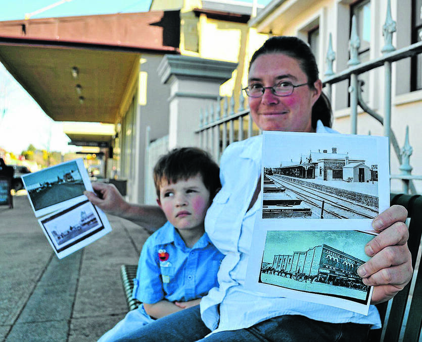 BLAYNEY: Blayney Camera Club president, Emma Jenkins, with some of the photos to be exhibited at the upcoming exhibition. She is pictured with her son, Albert.