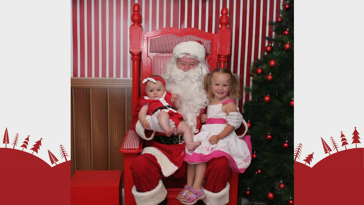 Our Santa photo taken today of my daughters (Violett, 3, and Indigo, 6 months) Flick across to see more photos. 