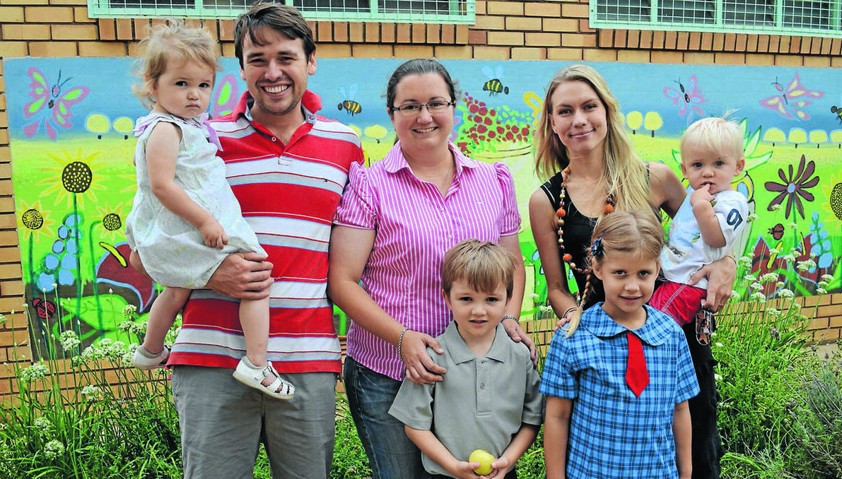 FORBES: Charlie Pearce and Imogen Collits are all ready for big school tomorrow. They are pictured with their families; Isabel, Matthew and Lucy Pearce and Tivoli Yeatman and Flyn Collits, who are anxious but excited for the first day of school. 0114kindy (6)