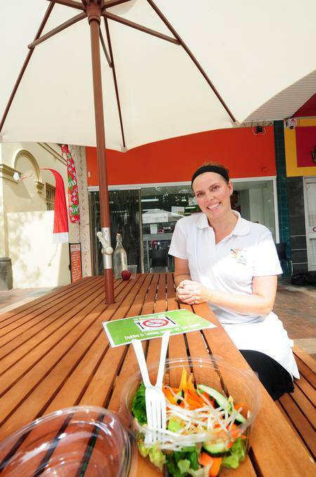DUBBO: Owner of salad run in Dubbo, Sharon Campbell, enjoys sitting in the business's smoke-free alfresco dining area.	 Photo: LOUISE DONGES