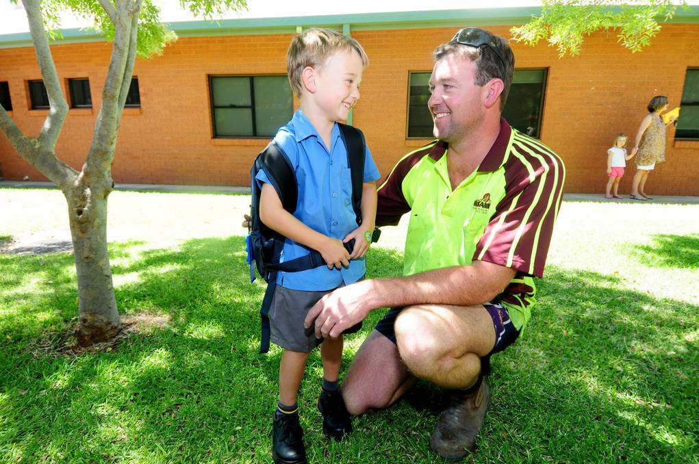 DUBBO: Riley Horsburgh, 5, tells his father Mark about his first day of kindergarten.	 Photo: LOUISE DONGES
