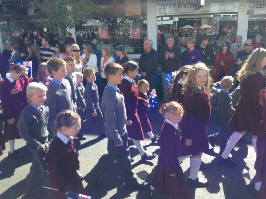 Sophie Grace Ziola marching in the Anzac Day March in Orange with the Catherine McCauley kids! Via: CWD iPhone App. 