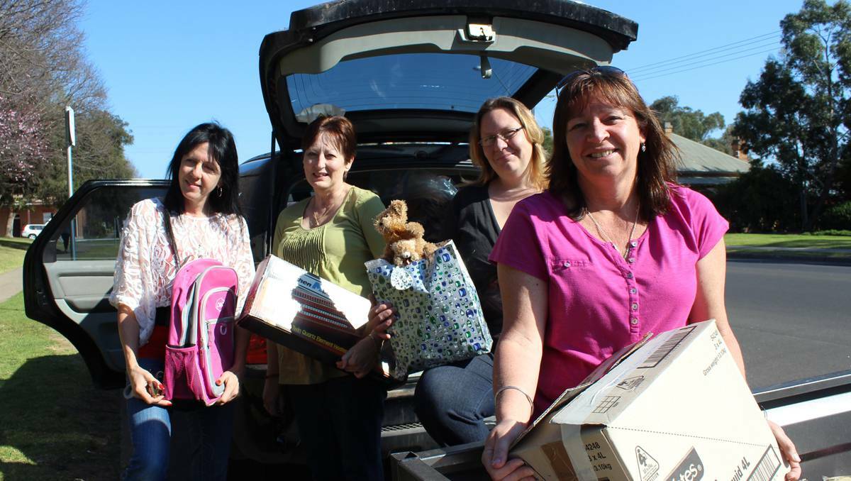 MUDGEE: Carol Stubbs, Kerry Smith, Amanda Malsem and Karen Callaghan all pitched in to deliver goods to a Kandos family who lost their house to fire on Father’s Day.