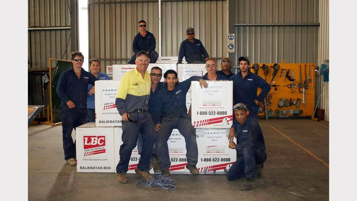PARKES: Transtank staff with some of the boxes of items collected for the appeal - from left, Darryn Piper, Corrine Swindle, Darryl Bishop, Dennis Leongson, Anthony Fowler, David Newham, Roy Pabora, Mitch Newham, Arti Tique, Kris McNeil and Kis Wonosroyo.