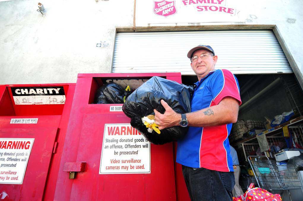 DUBBO: Manager of The Salvation Army Family Store in Dubbo's Darling Street, Lindsay Foggon, attends to an influx of donations delivered on Monday when it reopened. Photo: LOUISE DONGES